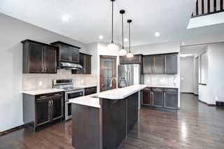 Photo 12: 387 St. Moritz Drive SW in Calgary: Springbank Hill Detached for sale : MLS®# A1185997