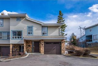 Photo 1: 316 Coachway Lane SW in Calgary: Coach Hill Row/Townhouse for sale : MLS®# A2035359