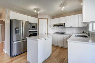 Photo 7: 238 Arbour Ridge Park NW in Calgary: Arbour Lake Detached for sale : MLS®# A2080628