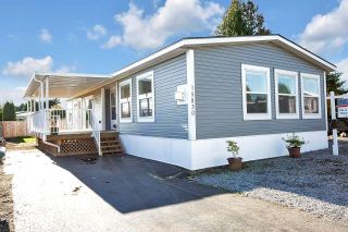 Photo 1: 15830 SUFFOLK Road in Surrey: Sunnyside Park Surrey Manufactured Home for sale in "CRANLEY PLACE" (South Surrey White Rock)  : MLS®# R2737792