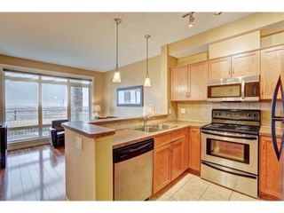 Photo 8: 1 169 Rockyledge View NW in Calgary: Rocky Ridge Row/Townhouse for sale : MLS®# A1241867