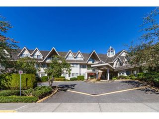 Photo 1: 204 19241 FORD Road in Pitt Meadows: Central Meadows Condo for sale in "VILLAGE GREEN" : MLS®# R2428267
