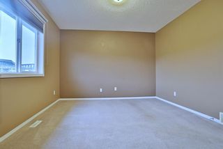Photo 15: 59 Tuscany Springs Gardens NW in Calgary: Tuscany Row/Townhouse for sale : MLS®# A2003672