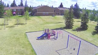 Photo 2: 12 4940 39 Avenue SW in Calgary: Glenbrook Row/Townhouse for sale : MLS®# A2001522