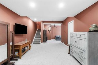 Photo 28: 332 Quigley Drive: Cochrane Semi Detached (Half Duplex) for sale : MLS®# A2126897