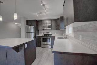 Photo 7: 405 Redstone View NE in Calgary: Redstone Row/Townhouse for sale : MLS®# A1224923