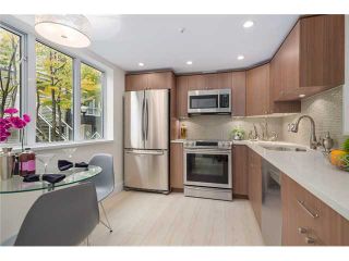 Photo 1: 101 789 W 16TH Avenue in Vancouver: Fairview VW Condo for sale in "Sixteen Willows" (Vancouver West)  : MLS®# V1087603
