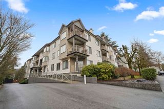 Photo 1: 206 5489 201 Street in Langley: Langley City Condo for sale in "CANIM COURT" : MLS®# R2747732