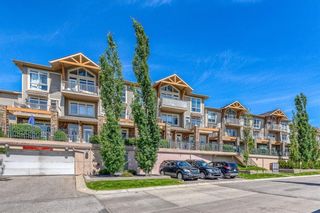 Photo 1: 1 169 Rockyledge View NW in Calgary: Rocky Ridge Row/Townhouse for sale : MLS®# A1241867