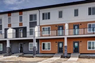 Photo 1: 198 Creekstone Drive SW in Calgary: C-168 Row/Townhouse for sale : MLS®# A2115444