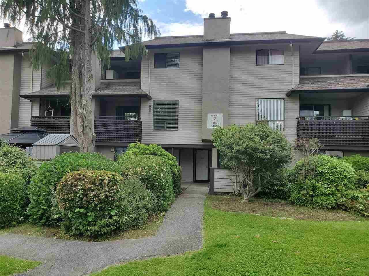 Main Photo: 14850 HOLLY PARK Lane in Surrey: Guildford Townhouse for sale in "HOLLY PARK LANE" (North Surrey)  : MLS®# R2466709
