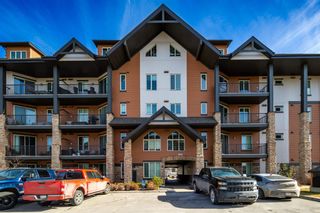 Photo 1: 3206 15 Sunset Square: Cochrane Apartment for sale : MLS®# A2120249