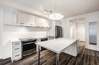 Photo 4: 103 730 5 Street NE in Calgary: Renfrew Apartment for sale : MLS®# A2011808