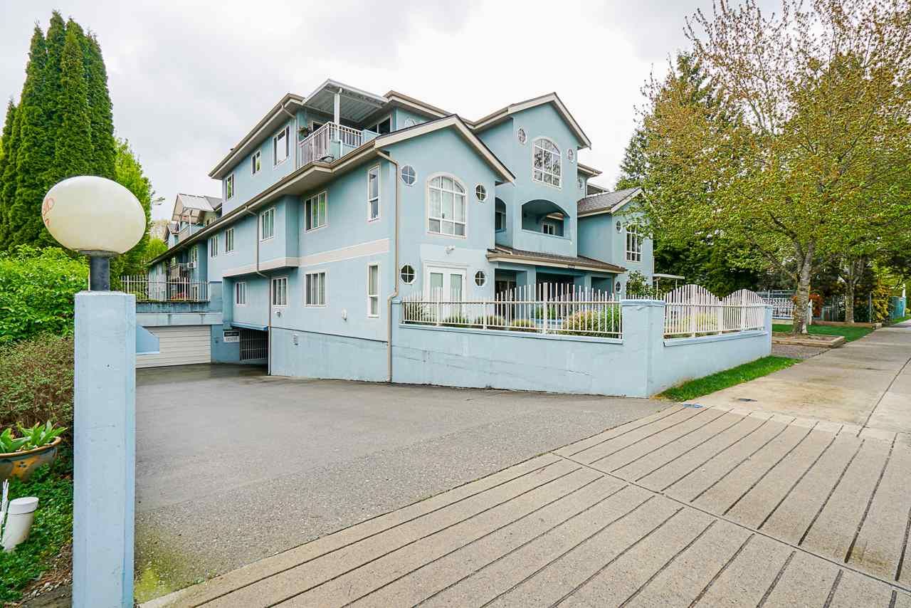 Main Photo: 207 5909 177B Street in Surrey: Cloverdale BC Condo for sale in "Carriage Court" (Cloverdale)  : MLS®# R2571222