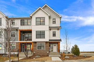 Photo 1: 750 Alpine Avenue SW in Calgary: C-163 Row/Townhouse for sale : MLS®# A2129334