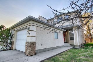 Photo 2: 49 SUN HARBOUR Road in Calgary: Sundance Row/Townhouse for sale : MLS®# A1102875