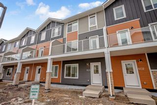 Photo 2: 603 335 Creekside Boulevard SW in Calgary: C-168 Row/Townhouse for sale : MLS®# A2120196