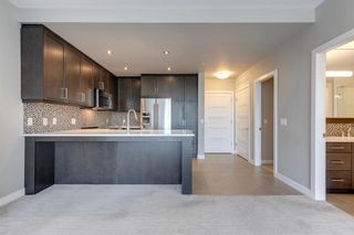 Photo 7: 211 145 Burma Star Road SW in Calgary: Currie Barracks Apartment for sale : MLS®# A2053707