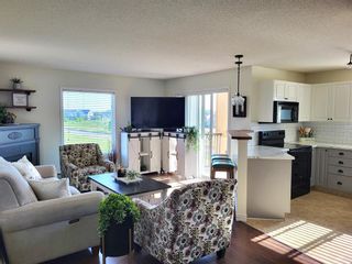 Photo 2: 6414 304 Mackenzie Way SW: Airdrie Apartment for sale : MLS®# A2053732