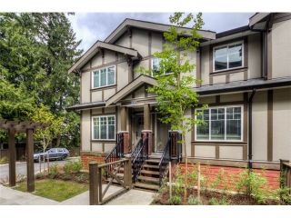 Photo 1: 112 3333 DEWDNEY TRUNK Road in Port Moody: Port Moody Centre Townhouse for sale in "Centre-Point" : MLS®# V1043145