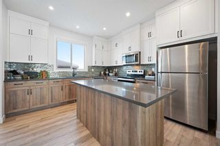 Photo 6: 86 Versant View SW in Calgary: C-163 Detached for sale : MLS®# A2144545