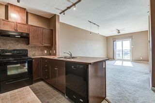 Photo 3: 1407 92 CRYSTAL SHORES Road: Okotoks Apartment for sale : MLS®# A1222250
