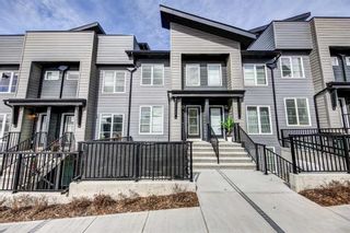 Photo 1: 313 260 Rowley Way NW in Calgary: C-483 Row/Townhouse for sale : MLS®# A2126450