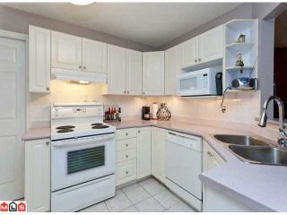 Photo 4: 115 7171 121ST Street in Surrey: West Newton Condo for sale in "THE HIGHLANDS" : MLS®# F1222154