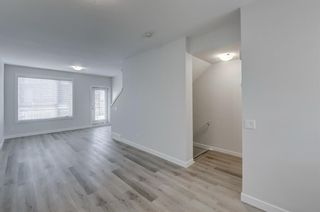 Photo 9: 406 16 Evanscrest Park NW in Calgary: Evanston Row/Townhouse for sale : MLS®# A1232145