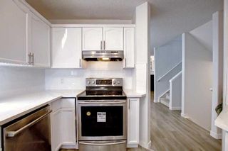 Photo 8: 43 Sun Harbour Road SE in Calgary: Sundance Row/Townhouse for sale : MLS®# A2057416