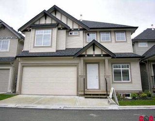 Photo 1: 23 6195 168 ST in Surrey: Cloverdale BC Townhouse for sale in "POET'S TRAIL" (Cloverdale)  : MLS®# F2604440