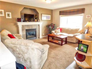 Photo 9: 1010 BRIDLEMEADOWS Manor SW in Calgary: Bridlewood House for sale : MLS®# C4065914