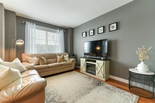 Photo 7: 11 West Coach Manor SW in Calgary: West Springs Row/Townhouse for sale : MLS®# A2035861