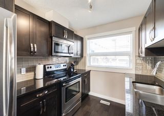 Photo 11: 424 Covecreek Circle NE in Calgary: Coventry Hills Row/Townhouse for sale : MLS®# A2035722