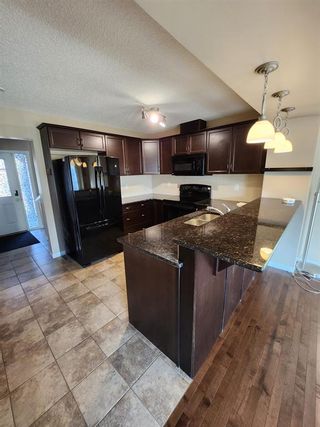 Photo 2: 265 Viewpointe Terrace: Chestermere Row/Townhouse for sale : MLS®# A2047342