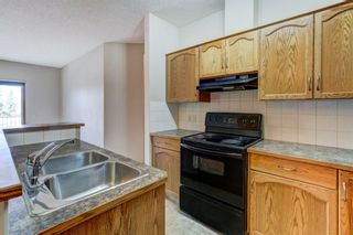 Photo 11: 103 72 Quigley Drive: Cochrane Apartment for sale : MLS®# A1149156
