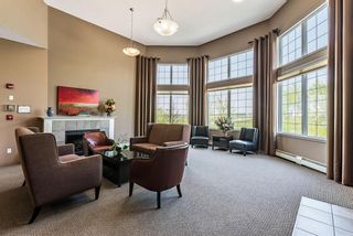 Photo 25: 323 1 Crystal Green Lane: Okotoks Apartment for sale : MLS®# A1086954