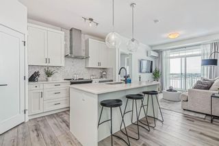 Photo 1: 413 400 Auburn Meadows Common SE in Calgary: Auburn Bay Apartment for sale : MLS®# A2021225