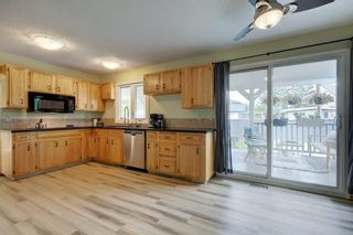 Photo 15: 411 Winterbourne Crescent SE in Calgary: Willow Park Detached for sale : MLS®# A2052135