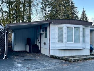 Photo 1: 37 4200 DEWDNEY TRUNK Road in Coquitlam: Ranch Park Manufactured Home for sale in "HIDEAWAY PARK" : MLS®# R2740993