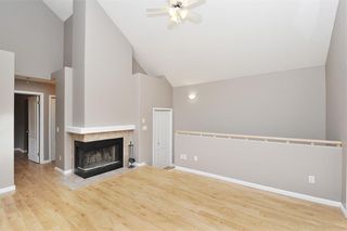 Photo 5: 205 1997 Sirocco Drive SW in Calgary: Signal Hill Row/Townhouse for sale : MLS®# A2102282
