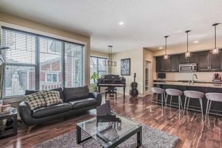 Photo 5: 128 Mike Ralph Way SW in Calgary: Garrison Green Detached for sale : MLS®# A2112996