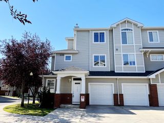 Photo 1: 1402 8000 Wentworth Drive SW in Calgary: West Springs Row/Townhouse for sale : MLS®# A1257578