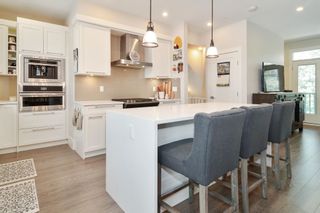 Photo 2: 82 7665 209 Street in Langley: Willoughby Heights Townhouse for sale in "ARCHSTONE" : MLS®# R2607778