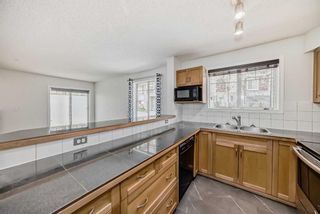 Photo 5: 5112 70 Panamount Drive NW in Calgary: Panorama Hills Apartment for sale : MLS®# A2129102