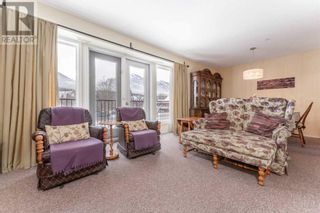 Photo 5: 8, 1302 Bow Valley Trail in Canmore: Condo for sale : MLS®# A2106986