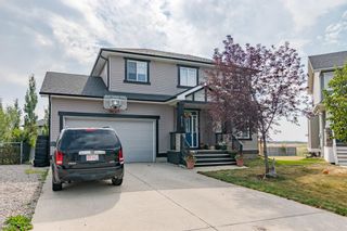 Photo 2: 213 Bishop Mews NW: Langdon Detached for sale : MLS®# A2001035
