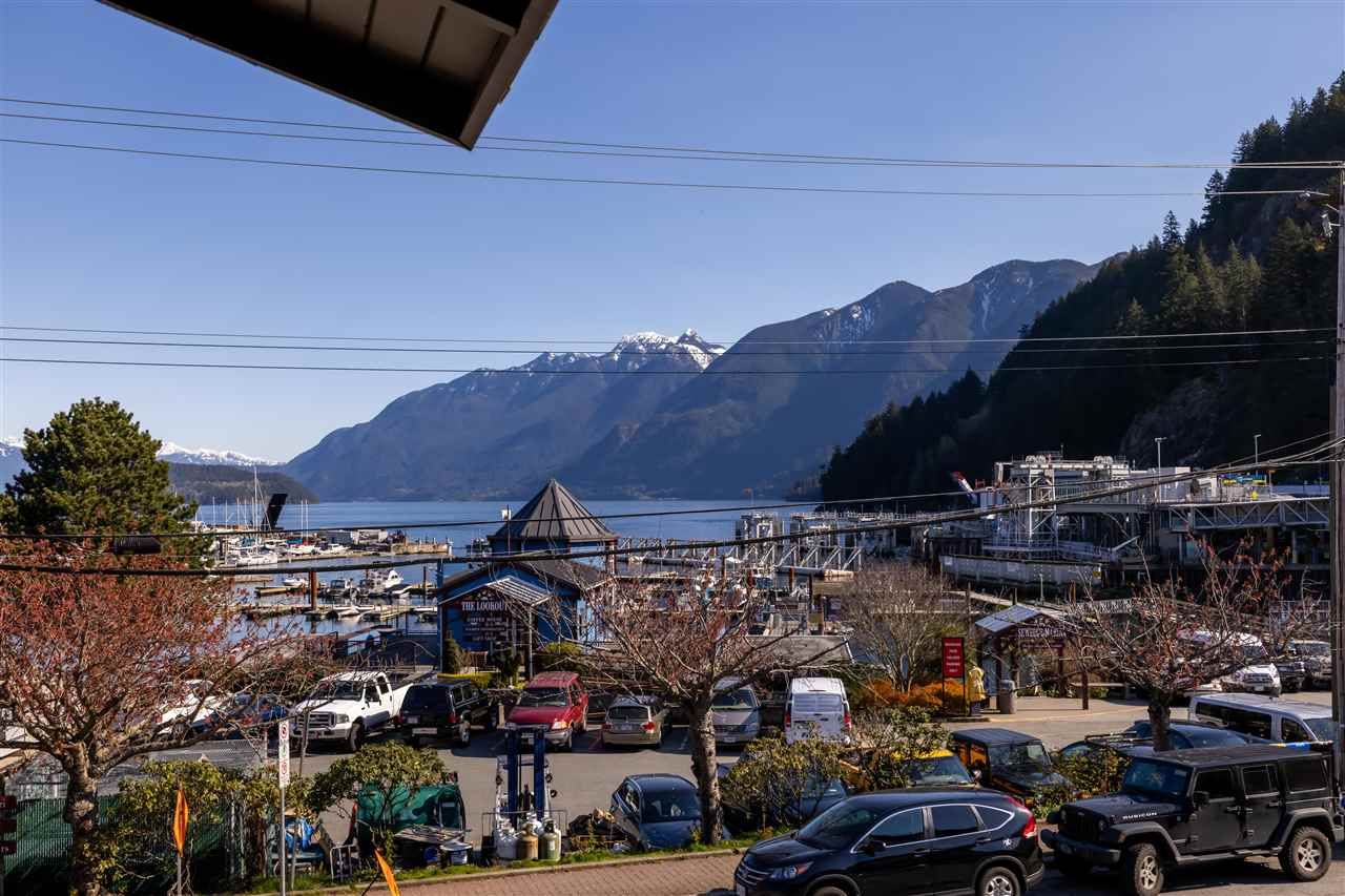 Main Photo: 202 6688 ROYAL Avenue in West Vancouver: Horseshoe Bay WV Condo for sale in "Galleries on the Bay" : MLS®# R2568247