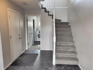 Photo 3: 88 Coachway Gardens SW in Calgary: Coach Hill Row/Townhouse for sale : MLS®# A1205157