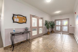 Photo 4: 210 248 Sunterra Ridge Place: Cochrane Apartment for sale : MLS®# A2053195